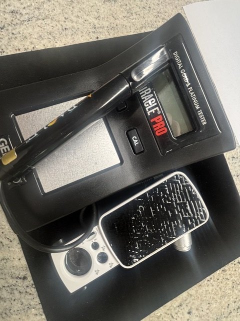 Digital gold and platinum tester and scale used to check purity